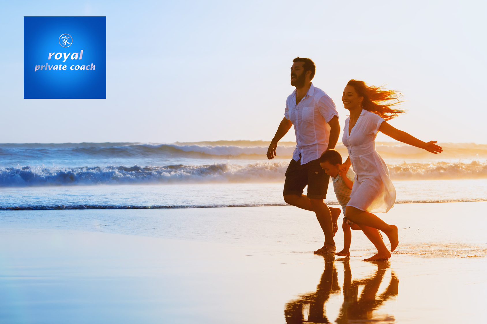 family running along beach with waves